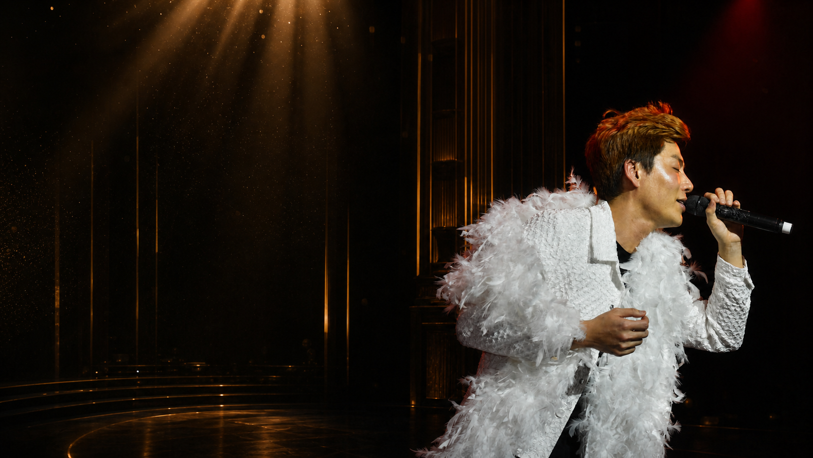 Đinh Công Phụng performing in a white feather costume
